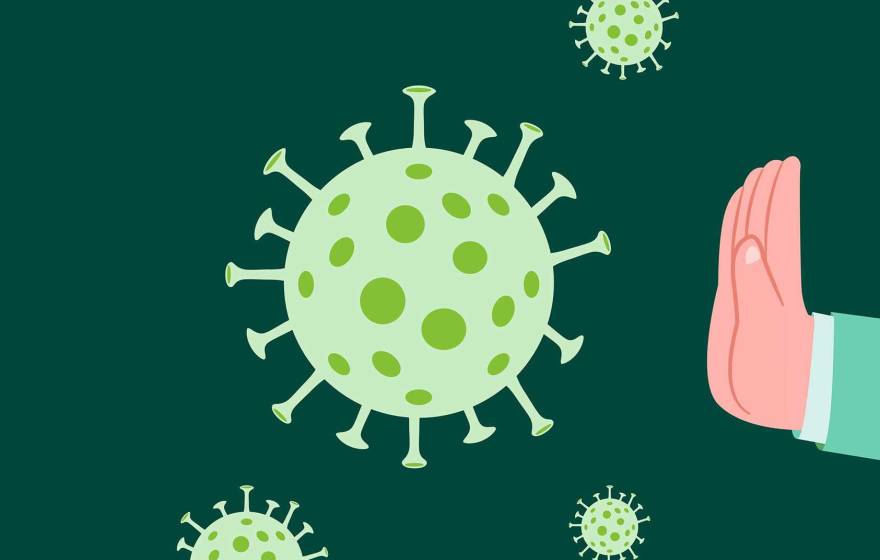 A COVID-19 molecule with a few smaller ones nearby, and a hand making a stop sign at it on a green background