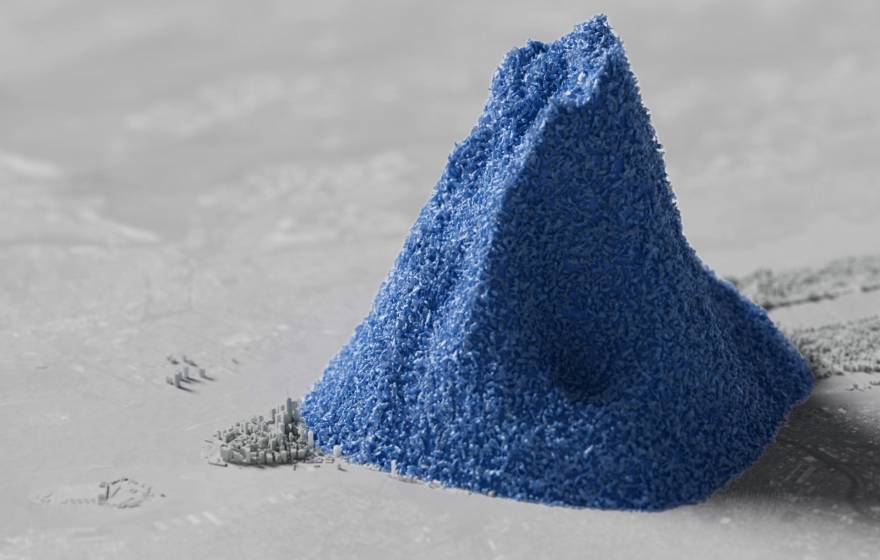 A computer-generated image of a pile of blue plastic beads dwarfing a colorless 3D rendering of Manhattan