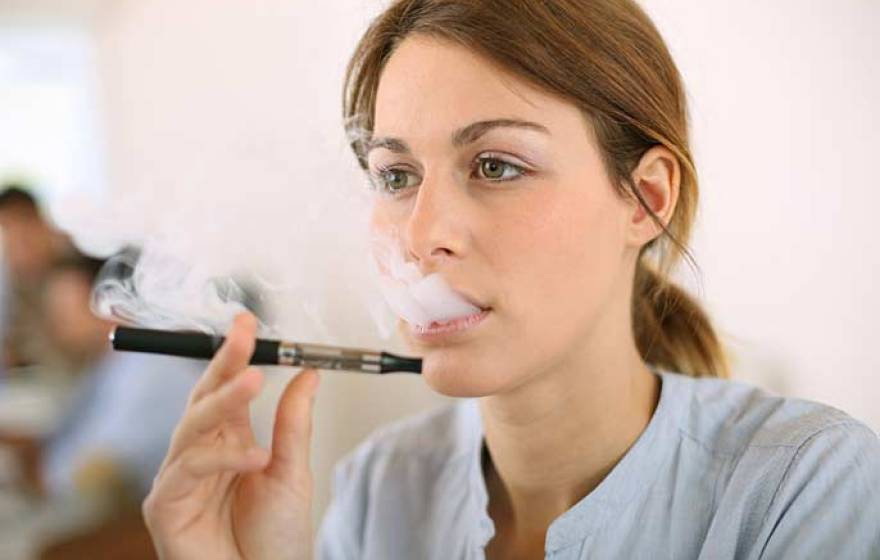 woman smoking e-cigarette