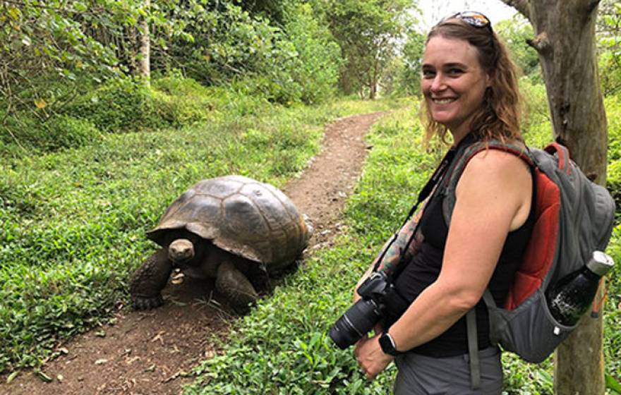 Professor Danielle Edwards with a tortoise on Galapagos