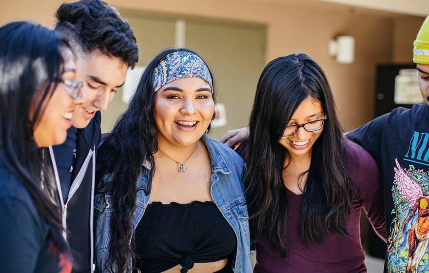 a group of students linking arms