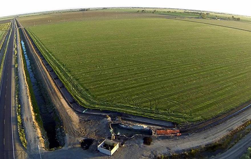 The upcoming climate-smart ag seminar will include discussions of California's elaborate water-delivery system, part of which is depicted in this photo of a Merced County field with its water pumps and adjacent irrigation canal.