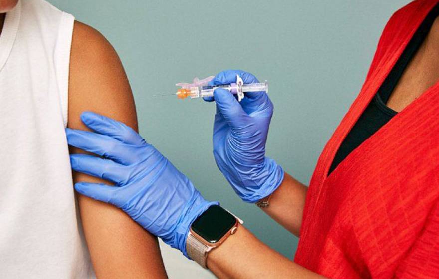 Nurse giving a flu shot to someone