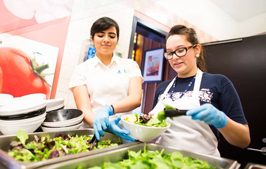 students serving food