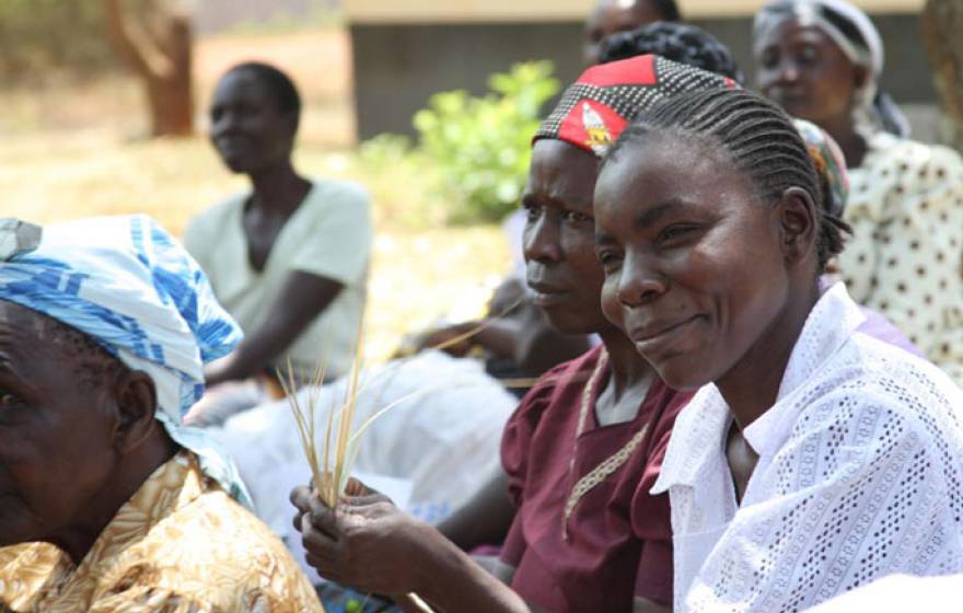 Women in western Kenya holding maize
