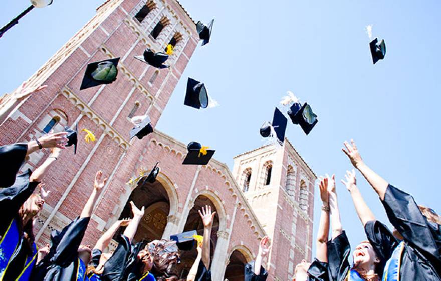UC graduation cap tossing
