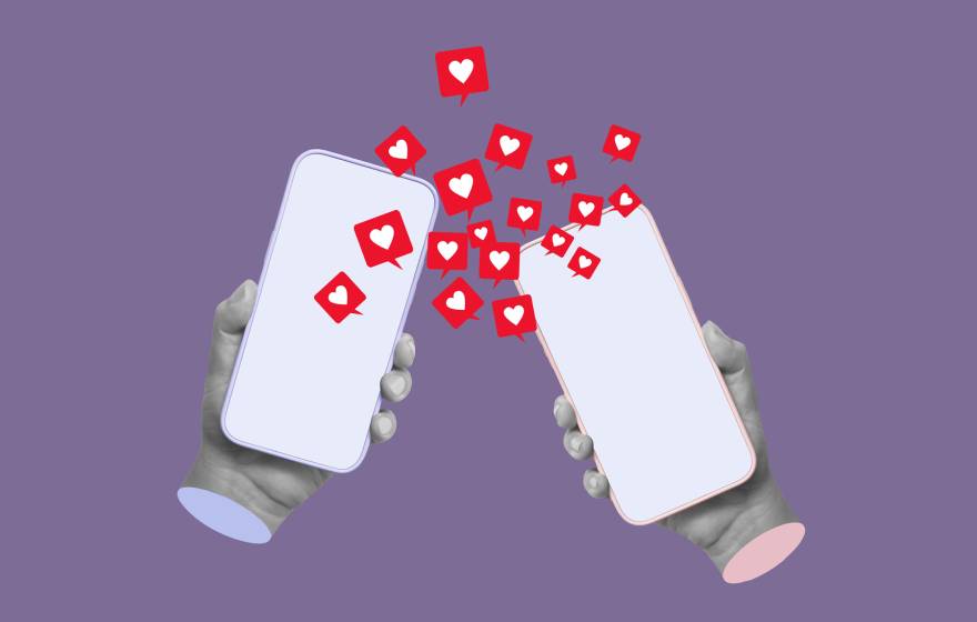 Two cell phones held by statues of hands have hearts coming from them