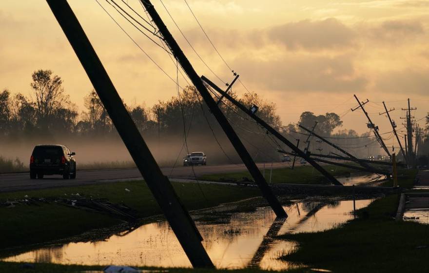 Downed powerlines off a flooded highway