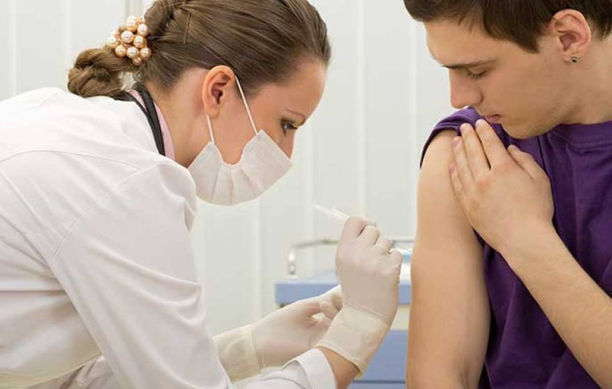 patient gets immunization shot