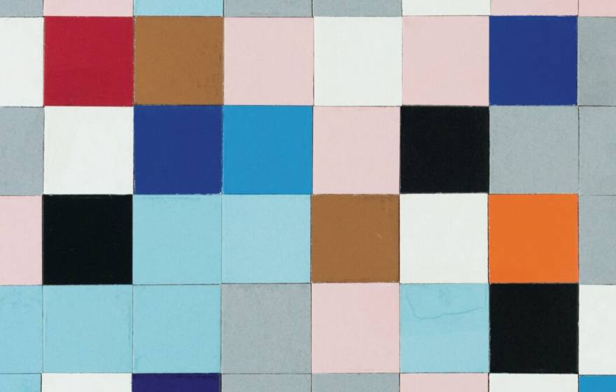 A grid of square tiles of different colors in a muted palette, in a seemingly random arrangement