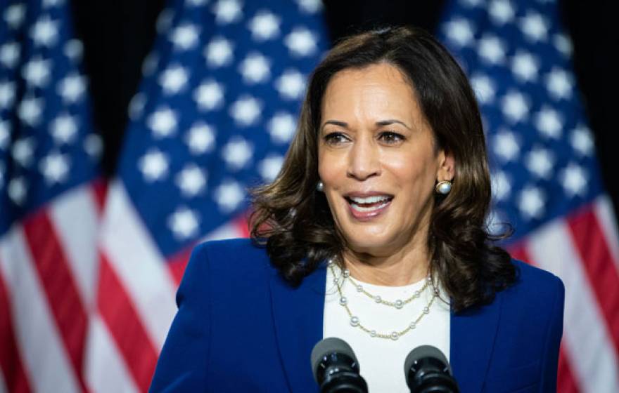 Kamala Harris speaking at a podium