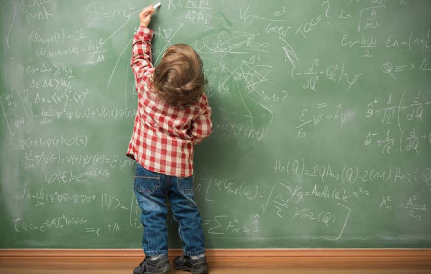 Left-handed child at blackboard