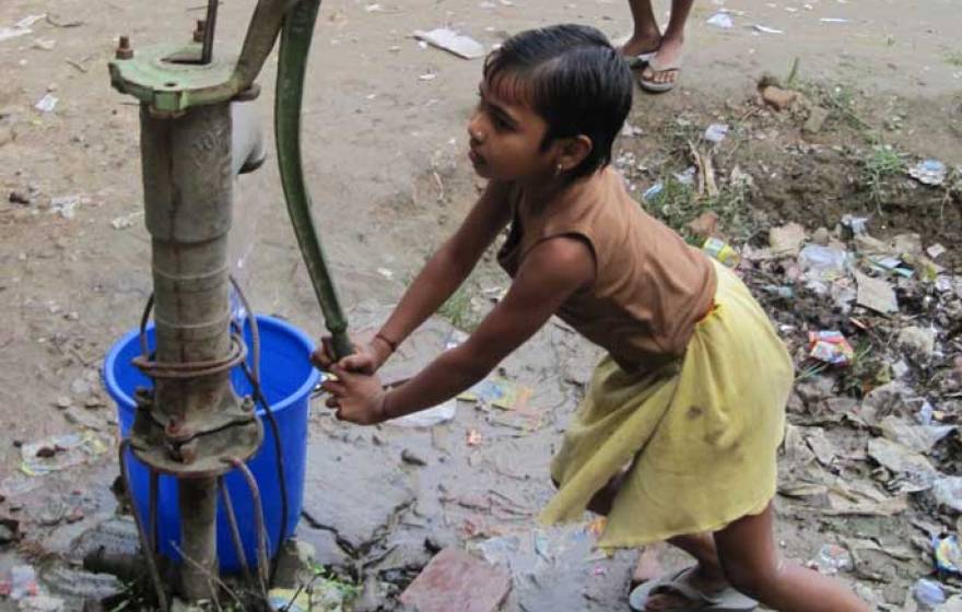 girl pumping water