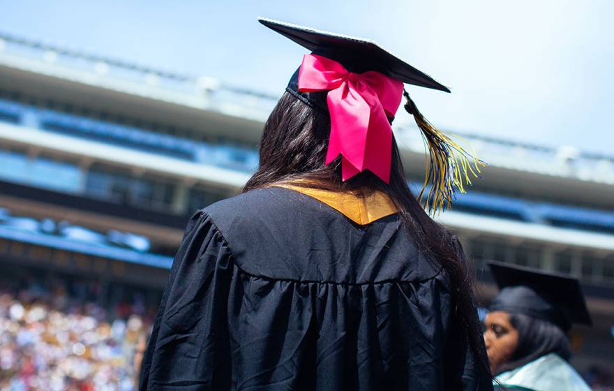 View of student in commencement cap and gown