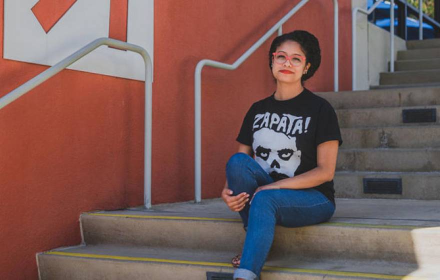 Marlen Ríos-Hernández sits on stairs