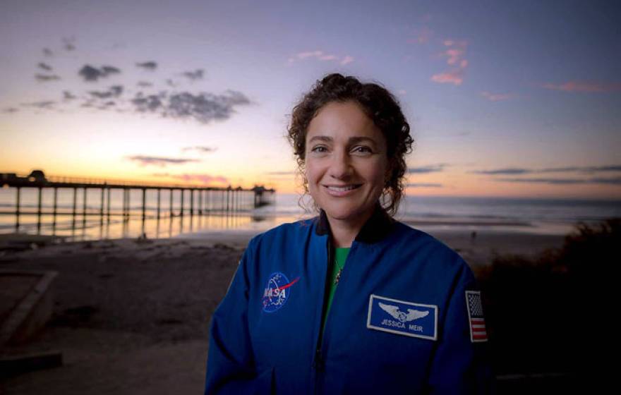 Jessica Meir in front of a pier in San Diego at sunset