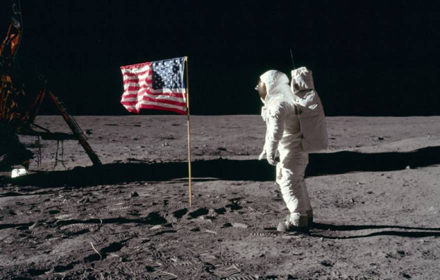 Buzz Aldrin salutes the U.S. flag