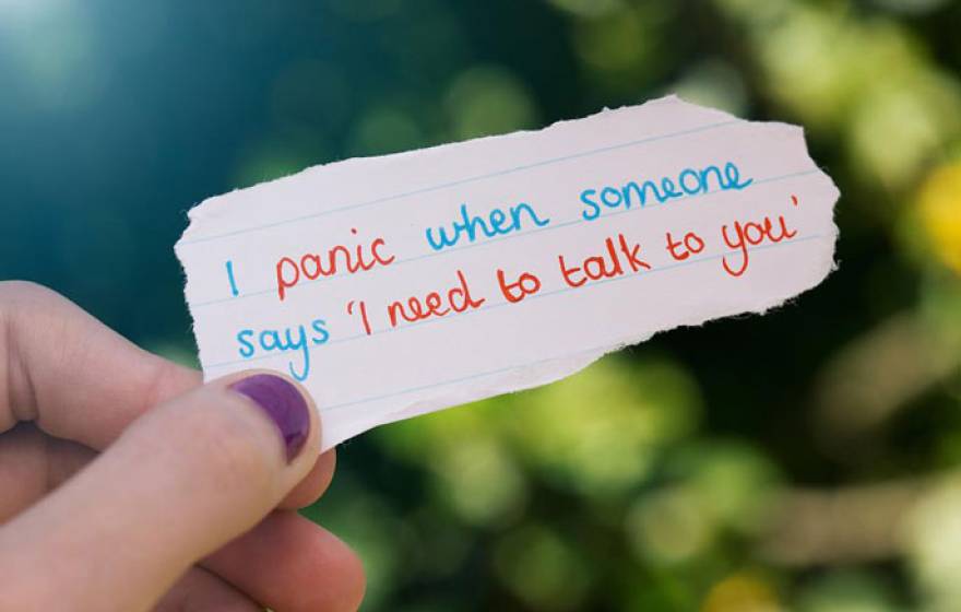 Message on paper that says I panic when someone says I need to talk to you