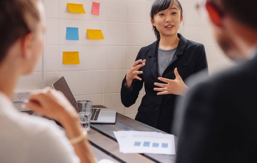 A young woman pitches an idea