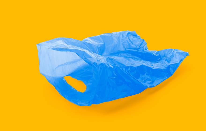 Blue plastic bag on gold background