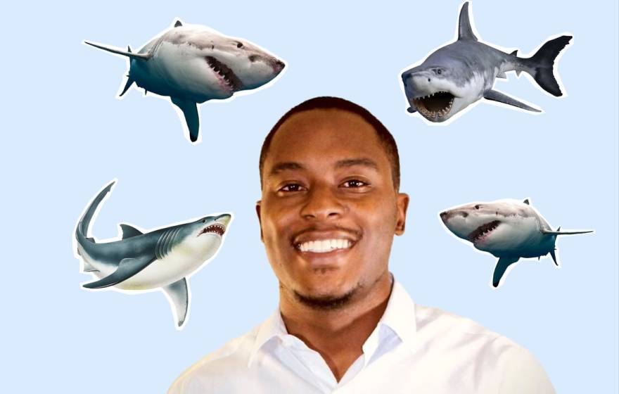 Young African American man De'Marcus Robinson, smiling, in the center of a shark collage