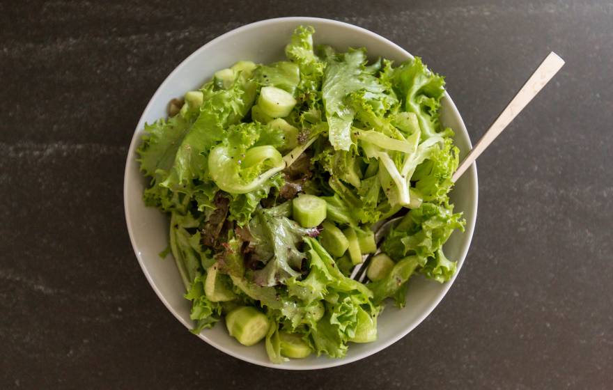 A bowl of salad viewed from overhead