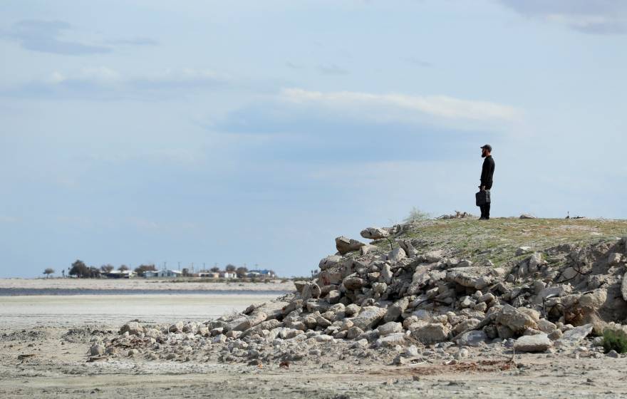 A man looks over the dry Salton Sea