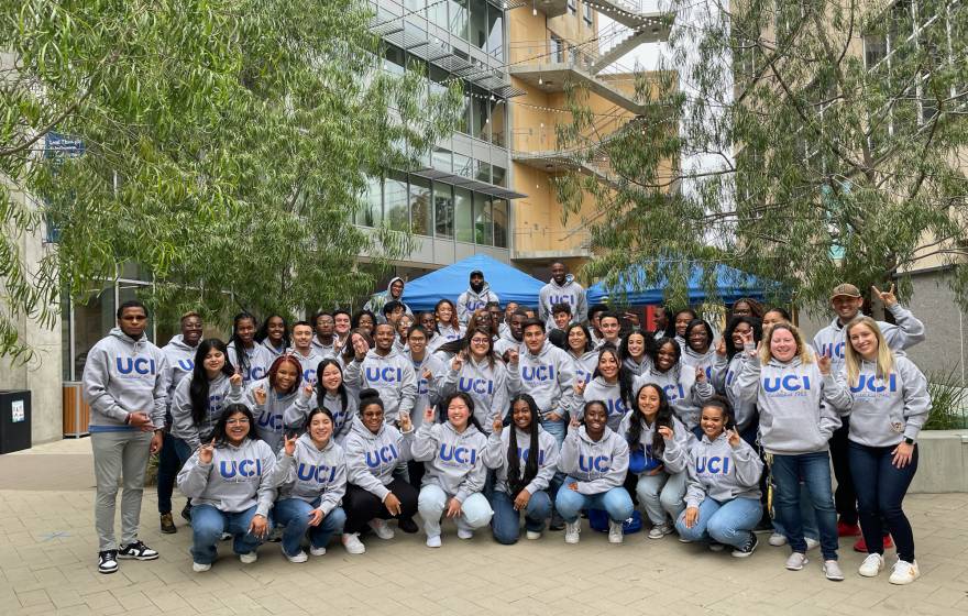 A group photo of SIEML 2023 on the UC Irvine campus, with everyone in UCI sweatshirts