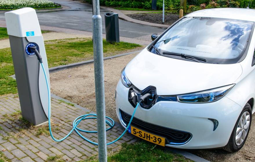 Charging Renault Zoe electric car on a parking place in the city of Zwolle, The Netherlands.
