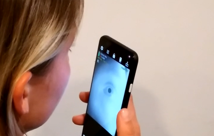 Woman looking into an app that shows her eye