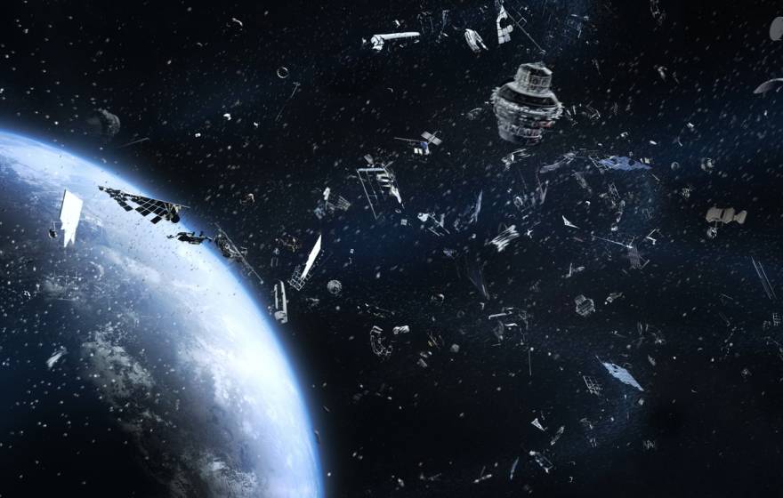 Artist's rendering of a cloud of metal scrap floating in orbit above earth, seen from space