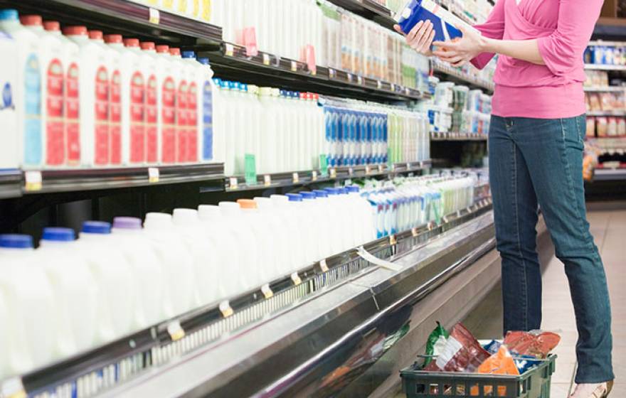 woman in milk aisle, supermarket