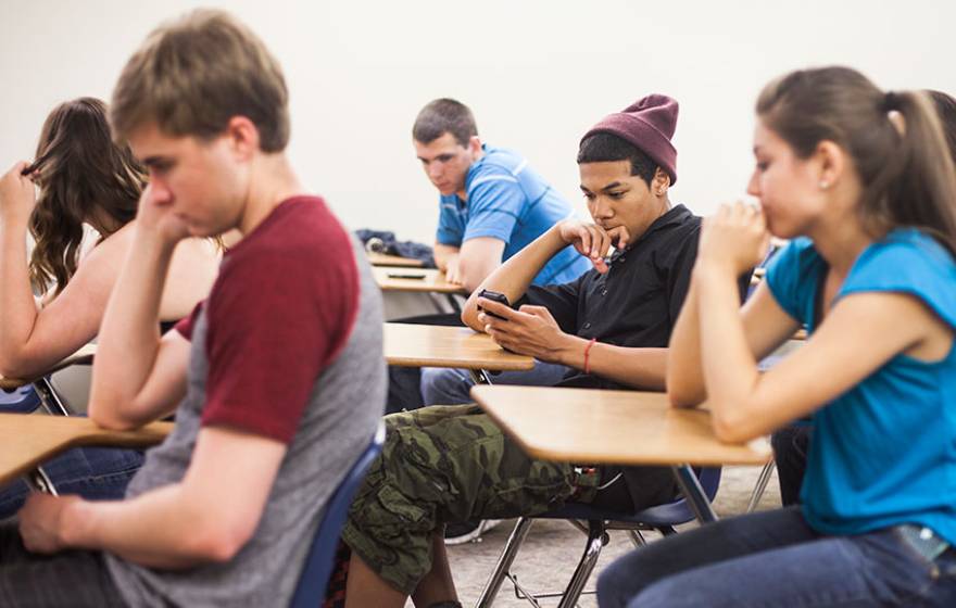 High school students texting in class