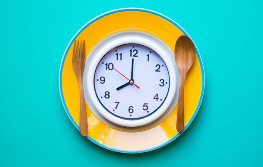 A clock on a dinner plate