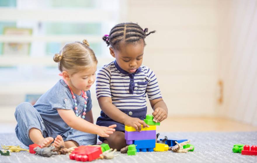 Two young children play together