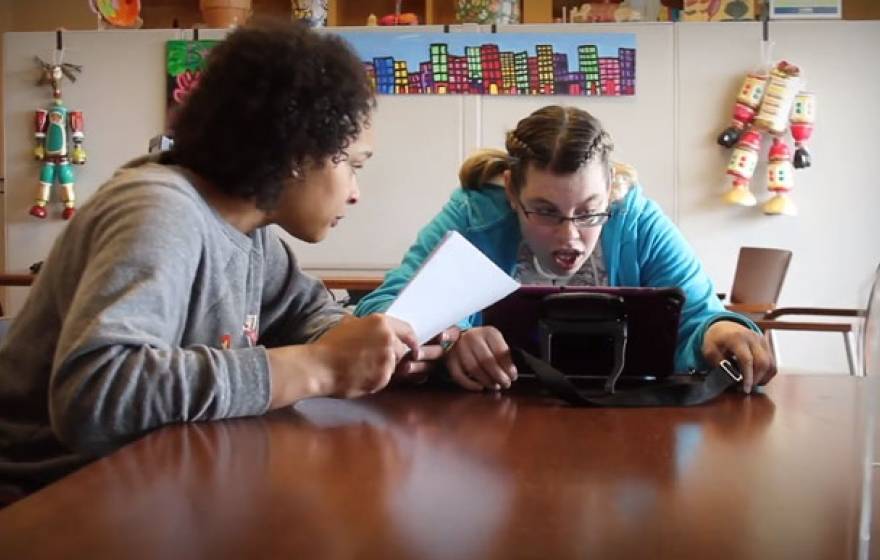 A teacher helping a student