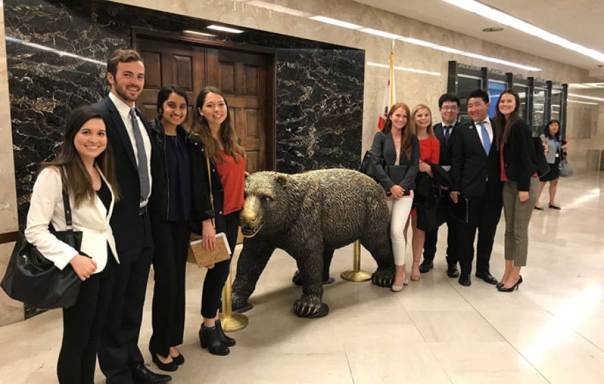 UCAN students next to bear statue in Sacramento