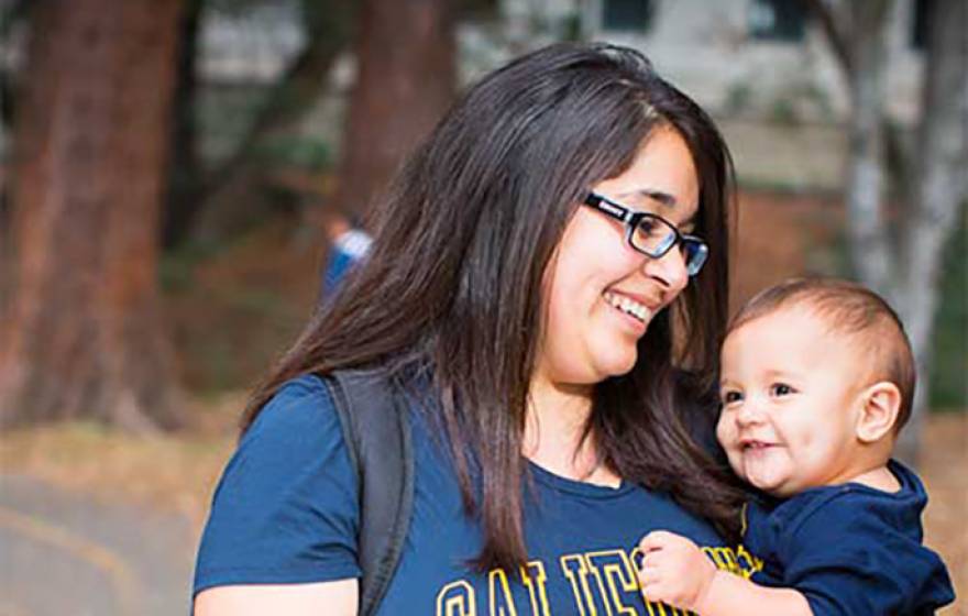 American Studies major Esperanza Campos, holding son Mauricio Ferrer, says the Cal Nourish gift cards “make a lot of difference” to student parents. 