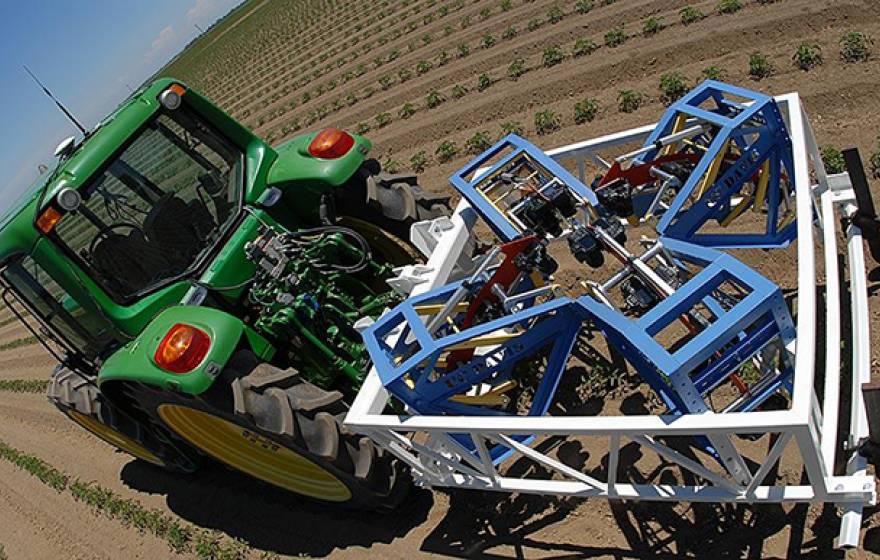 The new tractor-drawn phenotyping machine, developed at UC Davis, can measure three plants per second, using advanced sensor technology. 
