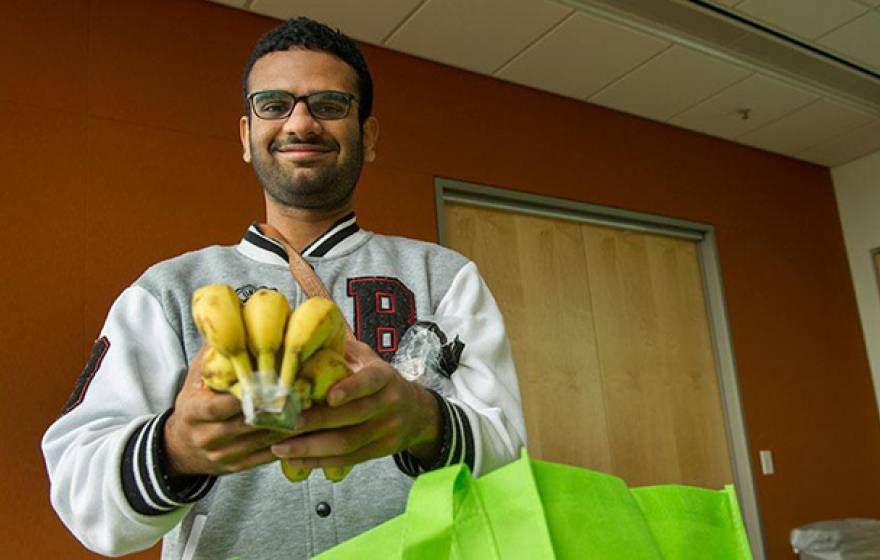 UC Davis graduate student Priyesh Shetty uses the free produce from the Fruit and Veggie Up! program to supplement his diet. 