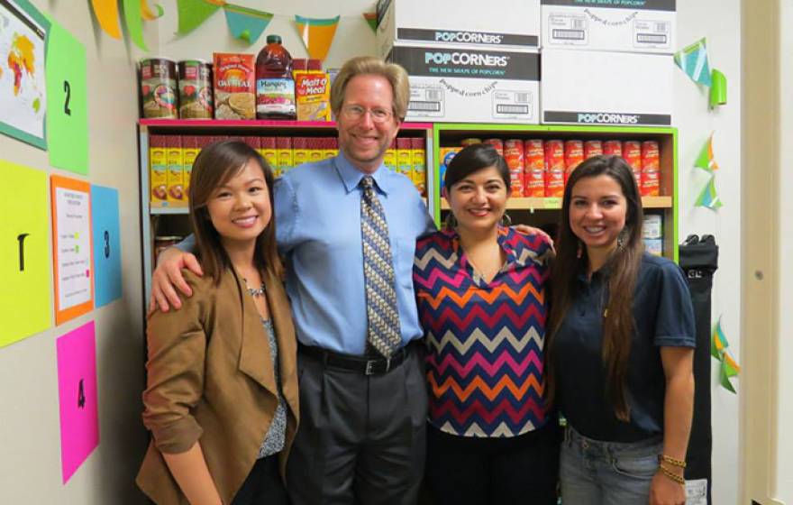 Standing inside the food pantry at UCI's Student Outreach & Retention Center are (from left) ASUCI food security Co-commissioner Erica Wong, Orange County Food Bank Director Mark Lowry, SOAR Director Graciela Fernandez and ASUCI food security Co-commissio