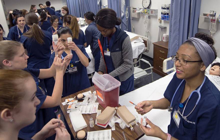 Undergrad nursing students practice injections in Berk Hall at UC Irvine.