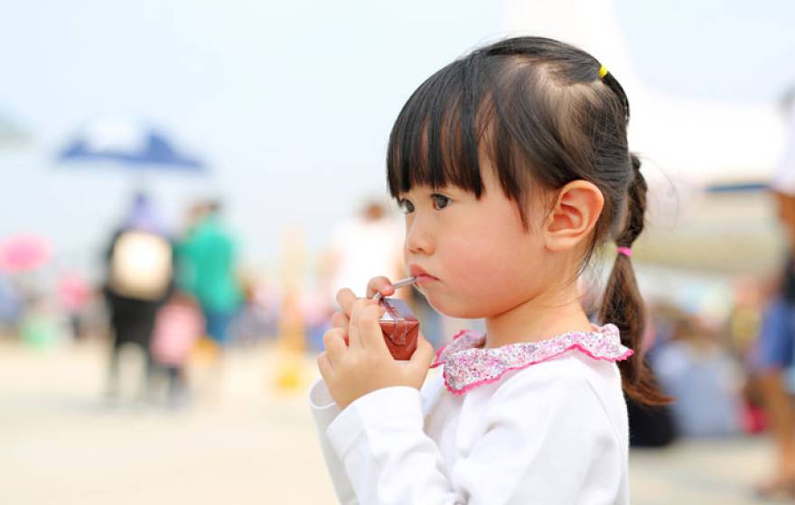 Child holding a juice box