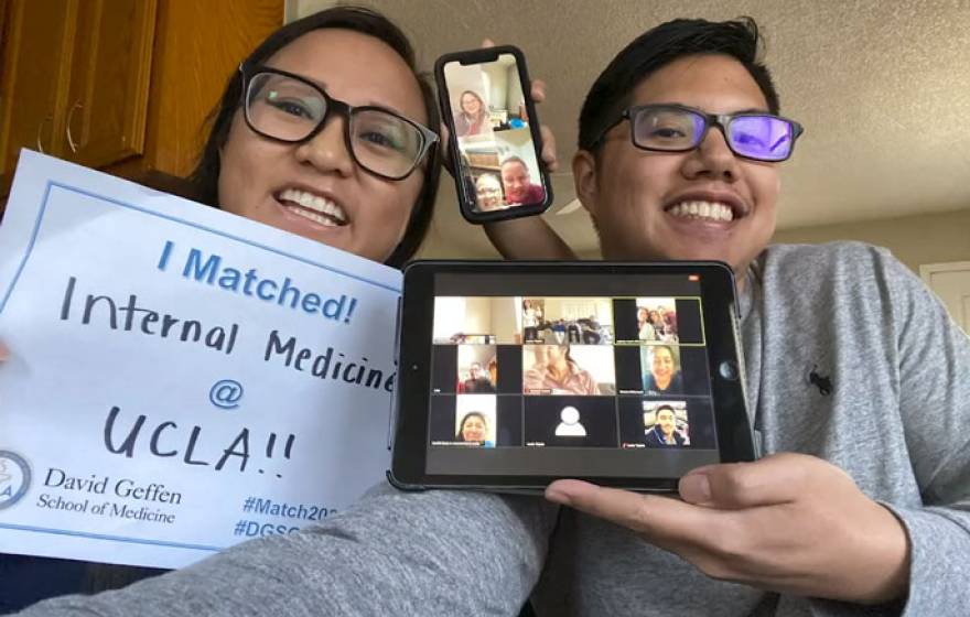 A young man and woman taking a selfie for Match Day