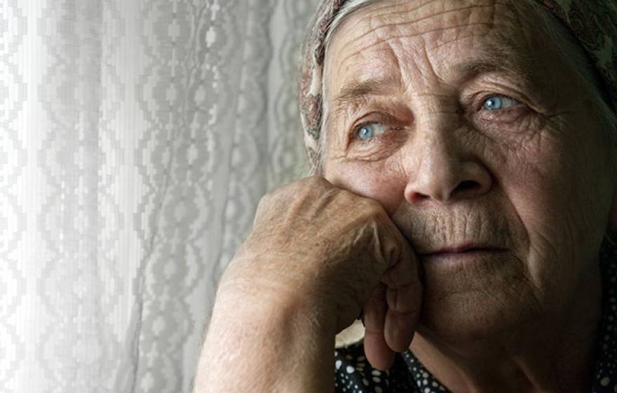 pensive elderly woman