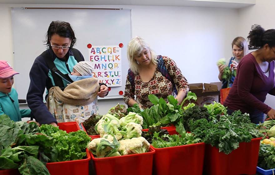 Rebecca Bork (middle) and her children, Ava and Finn, are among those who benefit from having fresh produce delivered by UCLA students to the UCLA University Village.