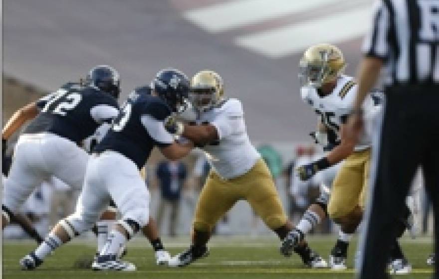 UCLA football players on the field