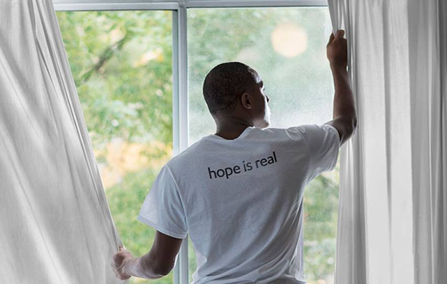man at window (Getty Images)