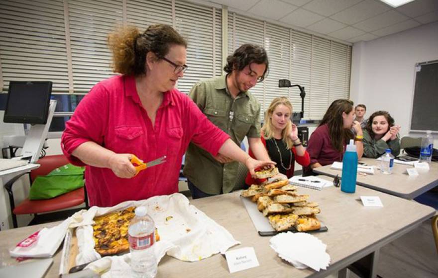 Evan Kleiman's students take a break from serious discussions about food issues to enjoy a focaccia pizza she made. Sharing food and recipes is an essential part of the course.