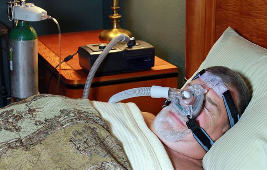 man with CPAP machine